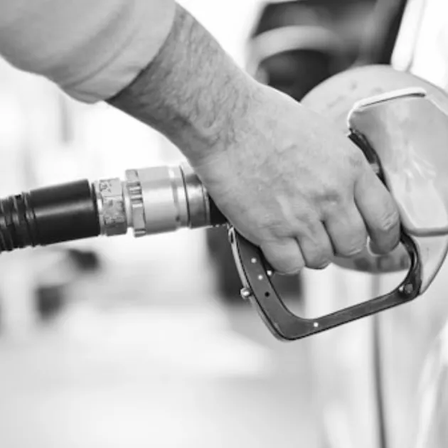 An image of a man refuelling a car.