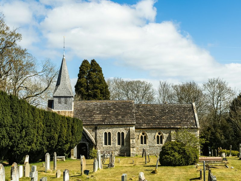 An image of a church graveyard in Henfield, UK.