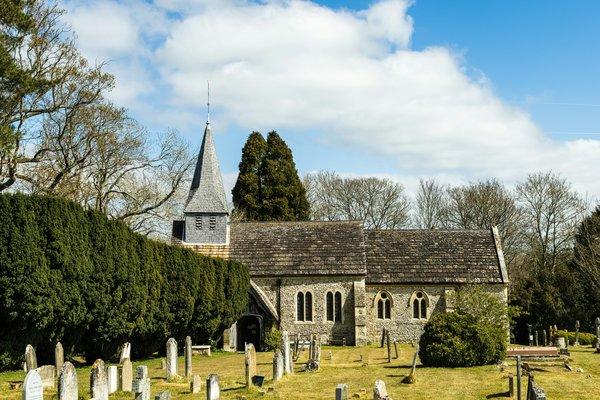 An image of a church graveyard in Henfield, UK.