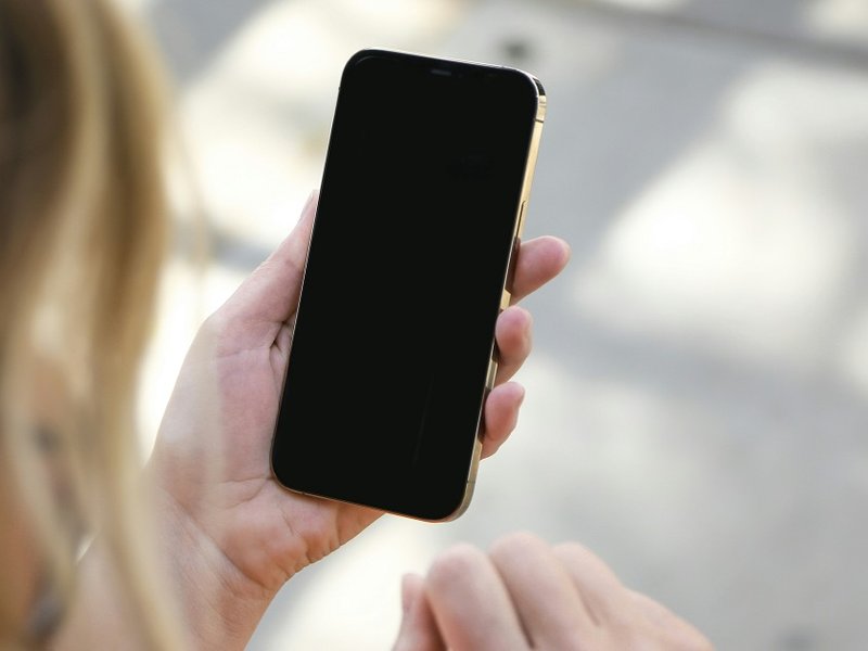 A woman holding a phone