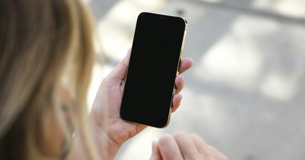 A woman holding a phone