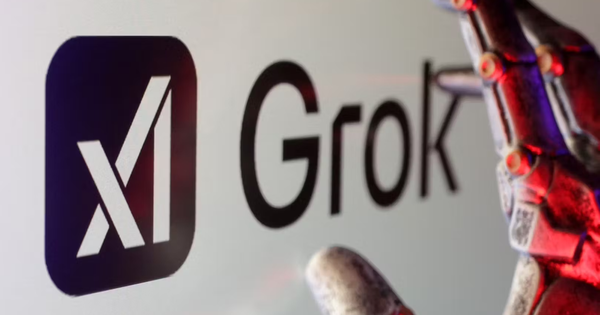 An image of the Grok AI logo with a robot hand in the foreground.