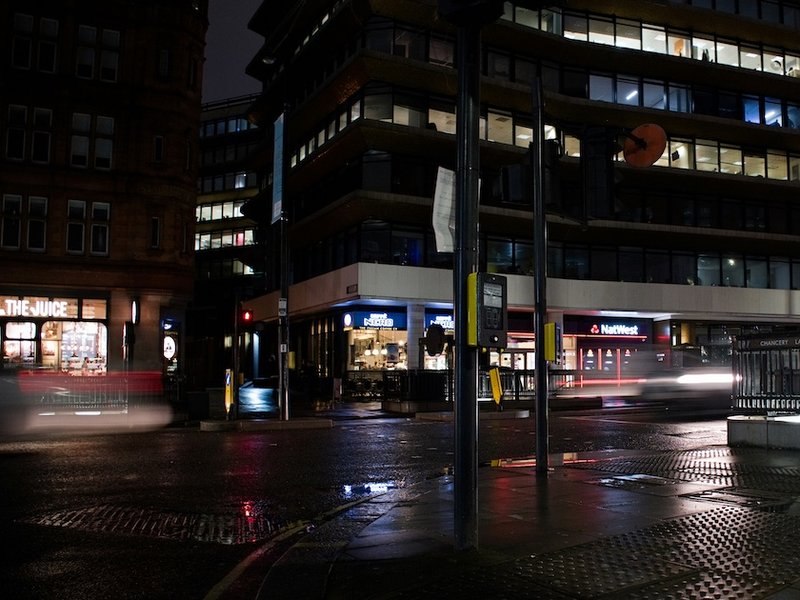 A picture of an empty street at night in London