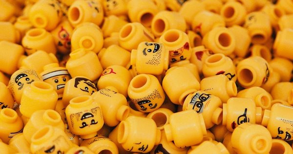 An assortment of Lego figurine heads in a pile