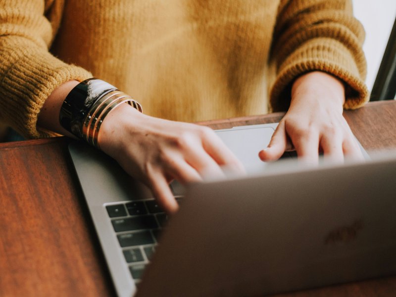 A person using a laptop.
