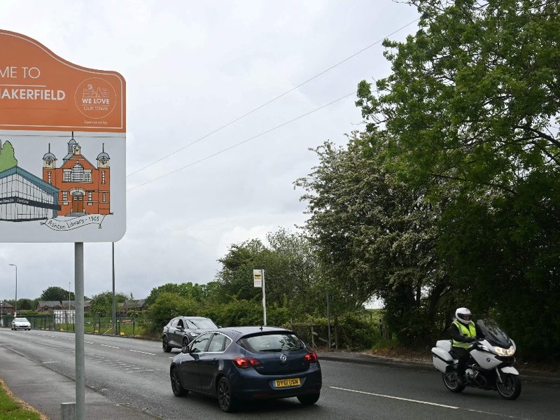 A road sign reading “Welcome to Ashton-in-Makerfield”.