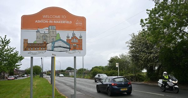 A road sign reading “Welcome to Ashton-in-Makerfield”.
