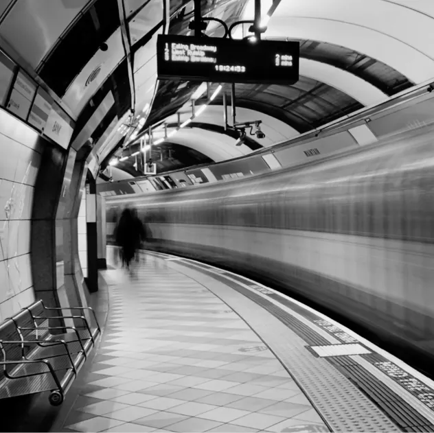 A picture of a Tube train travelling through Bank London Underground station.