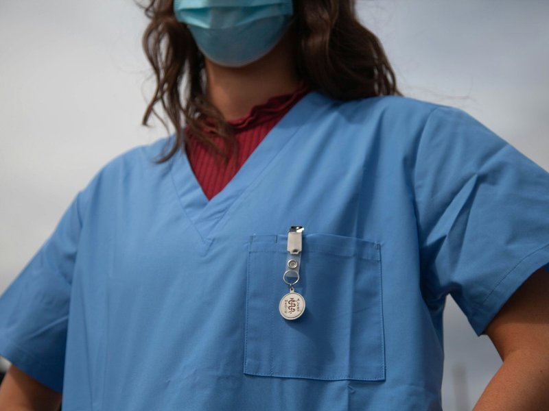 A nurse wearing a mask