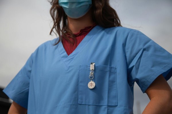A nurse wearing a mask