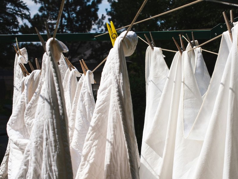 White sheets hanging on a clothes line