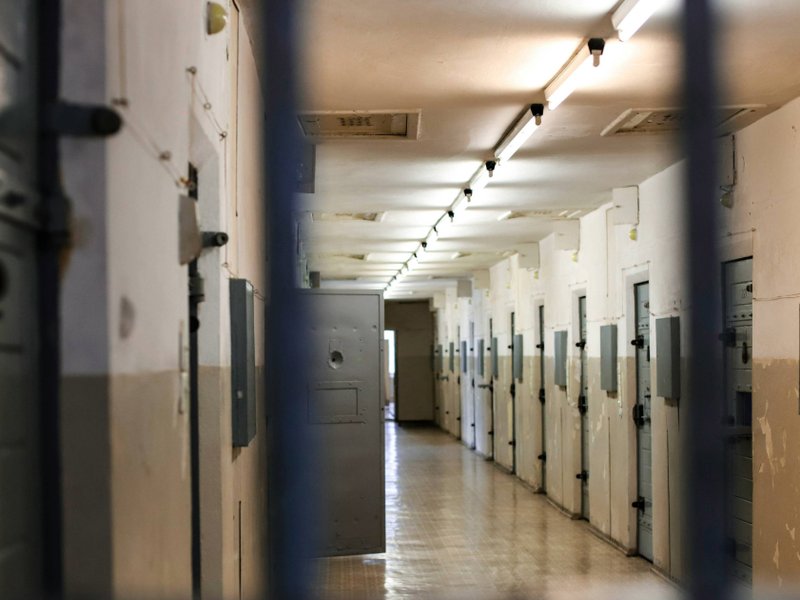 Prison corridor with metal doors