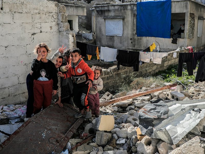 Palestine children among the rubble of a house in Gaza