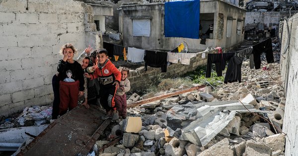 Palestine children among the rubble of a house in Gaza