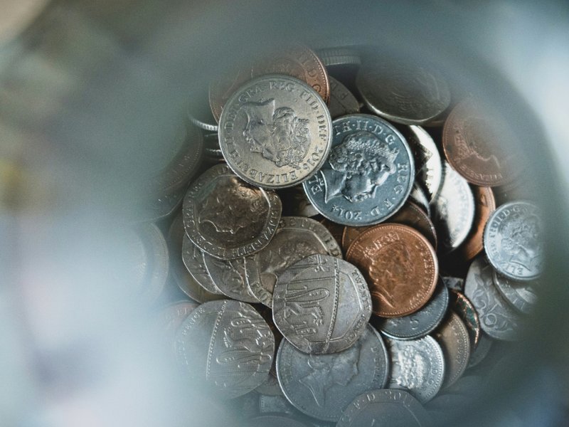 A picture of coins in a jar
