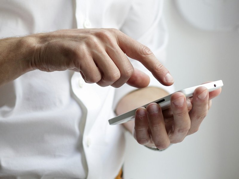 A photo of a person holding a phone