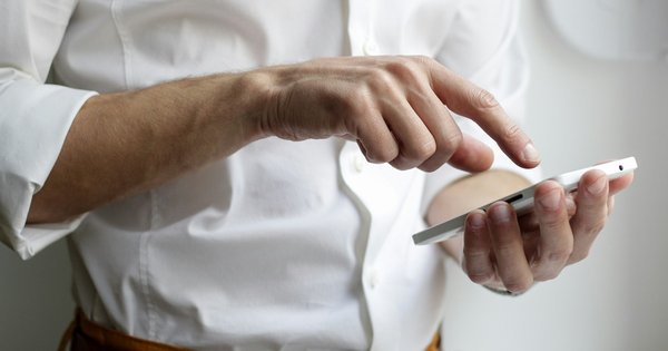 A photo of a person holding a phone