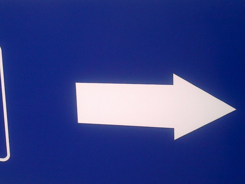 A pay and display parking sign.