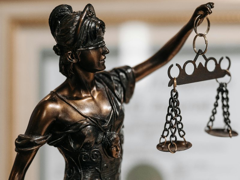 Themis figurine at lawyers office
