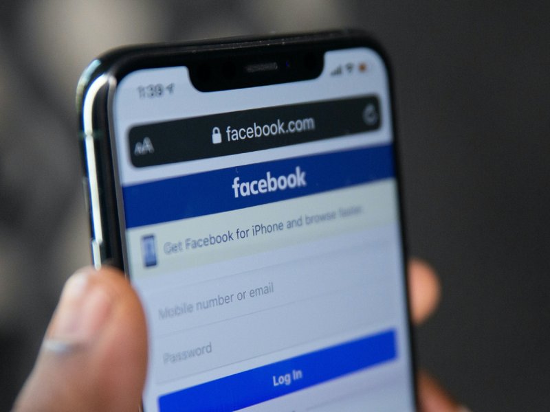 A mobile phone showing a log in page for Facebook.