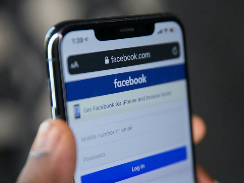 A mobile phone showing a log in page for Facebook.