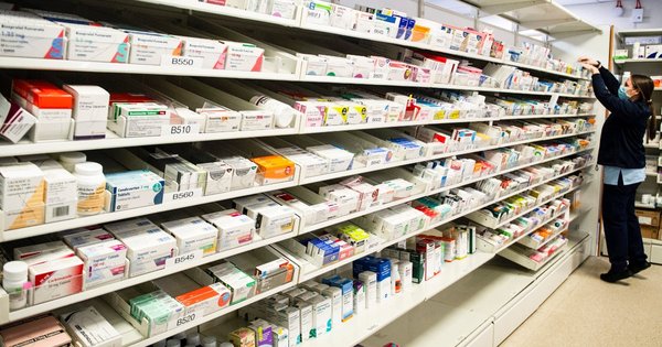 Medications on shelves in a pharmacy.