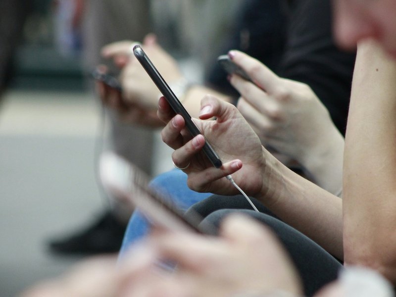 Blurred people using phones