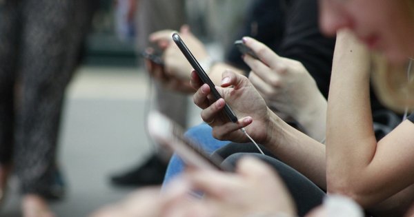 Blurred people using phones