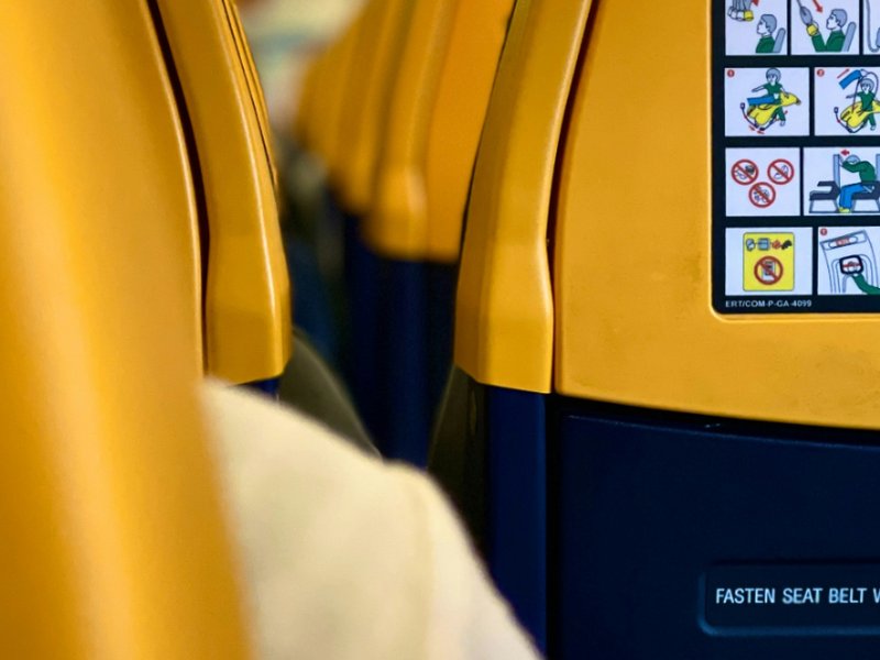 The inside of a Ryanair aeroplane cabin.