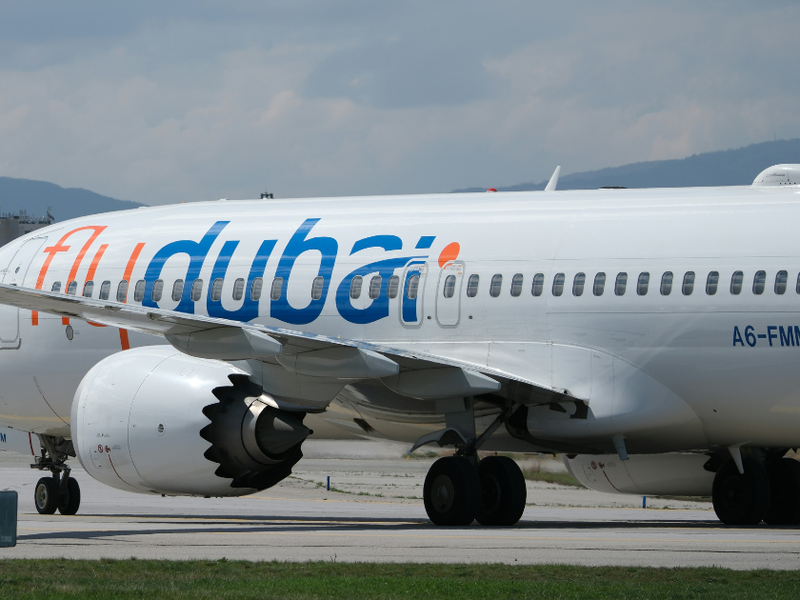 A photo of a Flydubai plane on a runway.
