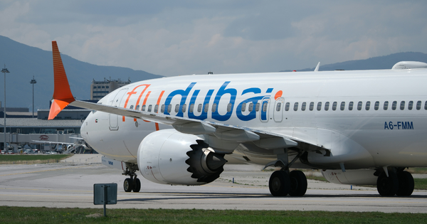 A photo of a Flydubai plane on a runway.