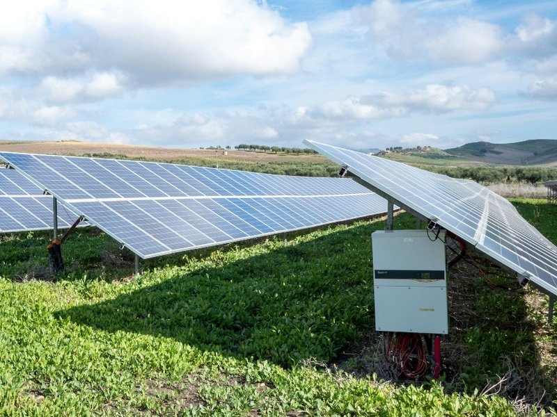 Rows of solar panels in a field