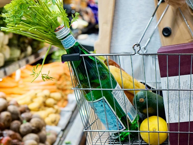A photo of a woman in a supermarket.
