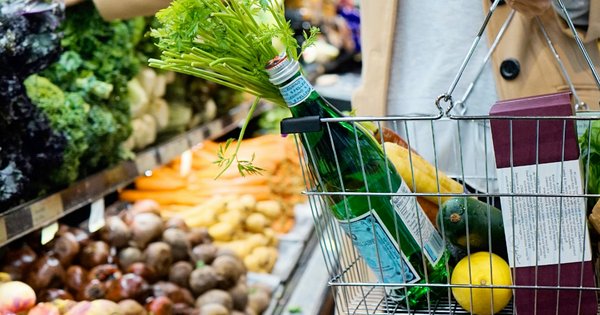 A photo of a woman in a supermarket.