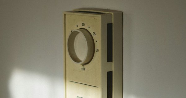 An image of a thermostat mounted on a wall