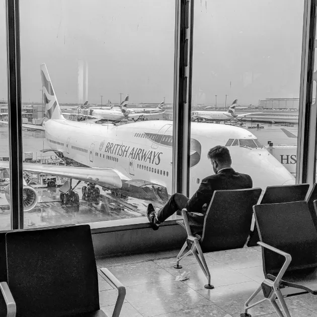 Man waiting for plane at Heathrow airport