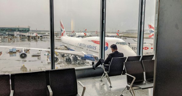 Man waiting for plane at Heathrow airport